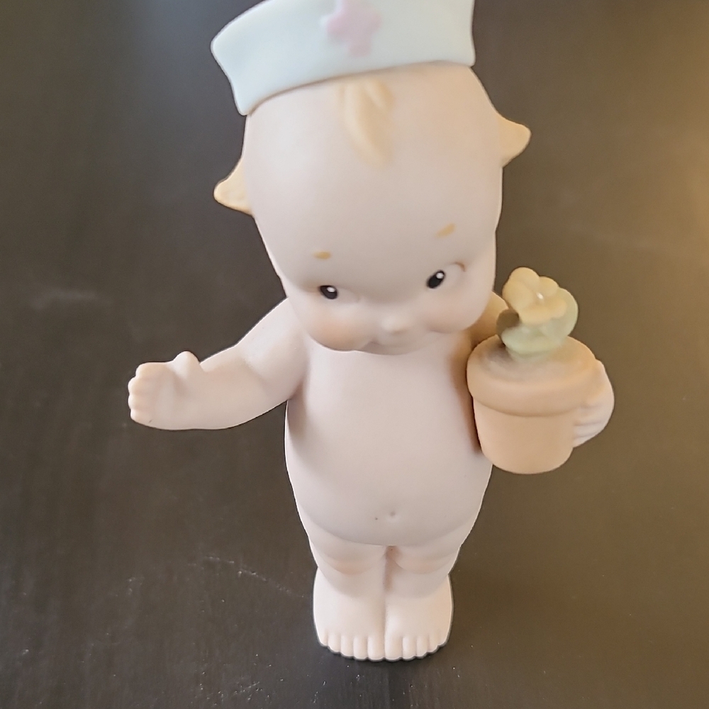 Adorable Porcelain Kewpie Doll Nurse Figurine with Flower Pot